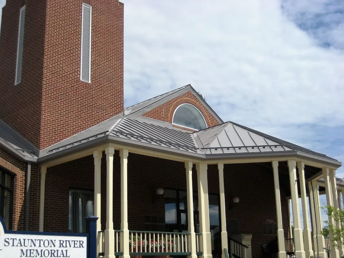 Skilled roofing craftsmen working on a residential roof in Stormville